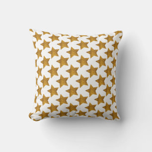 Coussin de fête avec étoiles dorées sur fond blanc
