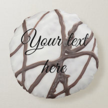 Coussin de gâteau brun noir et blanc