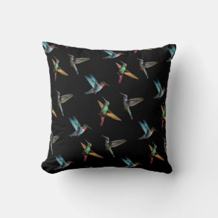 Coussin De mignons colibris multicolores sur fond noir