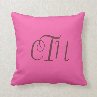 Coussin de monogramme rose chaud