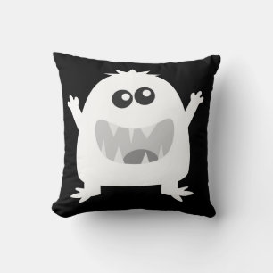 Coussin de monstre heureux en noir et blanc