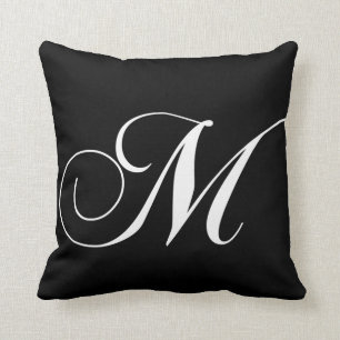 Coussin décoré d'un monogramme de concepteur blanc