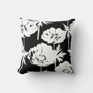 Coussin Des fleurs blanches sur du noir.