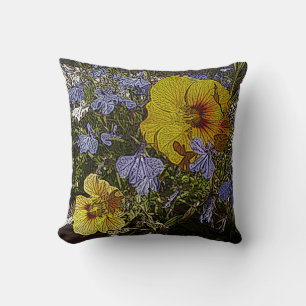 Coussin design avec beaucoup de fleurs jaunes bleues et bl