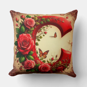 Coussin Élégante lettre C rouge par Roses et Papillon