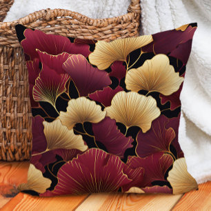 Coussin Élégantes feuilles de ginkgo bordeaux or sur fond