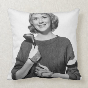 Coussin Femme tenant le club de golf
