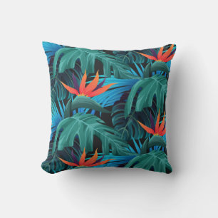 Coussin feuilles tropicales vibrantes et fleurs orange