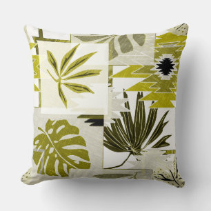 Coussin feuilles tropicaux et éléments ornementaux.