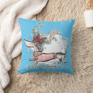 Coussin Fille teckel à travers la neige