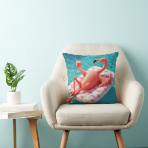 Coussin Flamant rose se relaxant sur un matelas de piscine