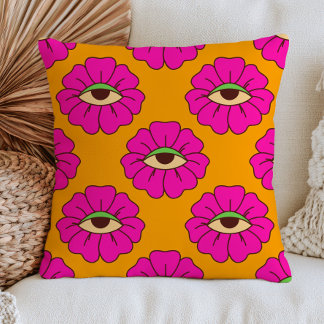 Coussin Fleurs d'œil maléfique rose fuchsia sur orange brû