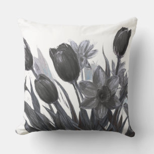 Coussin Fleurs noires sur canapé-lit à fond blanc Chaise
