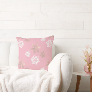 Coussin flocons de neige sur rose pâle