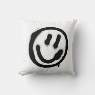 Coussin graffiti visage souriant émoticon en noir sur blan