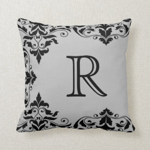 Coussin gris et noir de damassé de monogramme
