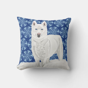 Coussin Husky blanc contre flocons de neige et ciel bleu f