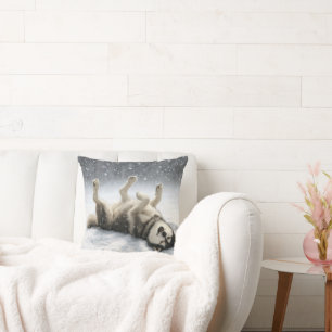 Coussin Husky sibérien créant un ange de neige