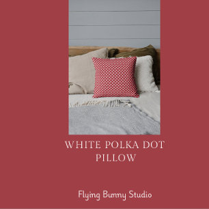 Coussin jeté à pois blancs sur fond rouge