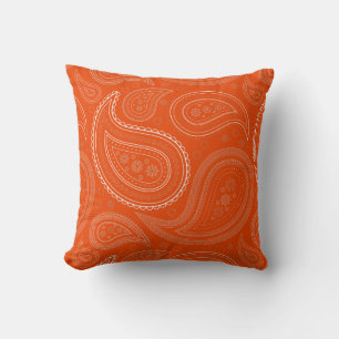 Coussin jeté orange vif à motif paisley blanc