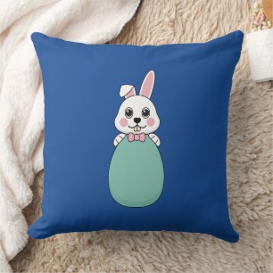 Coussin Joli lapin blanc tenant l'oeuf de Pâques