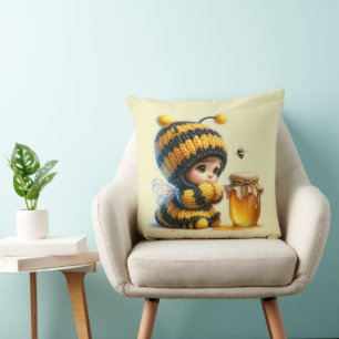Coussin Jolie fille en costume d'abeille avec du miel