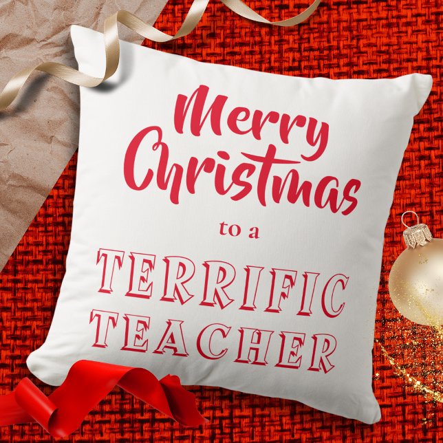 Coussin Joyeux Noël à un Enseignant Extraordinaire Rouge B (A festive red and white throw pillow cushion, with the words 'Merry Christmas to a Terrific Teacher')