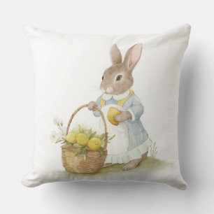 Coussin lapin mignon avec un panier en osier de citrons