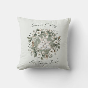Coussin Lapins mignons dans une couronne florale hivernale