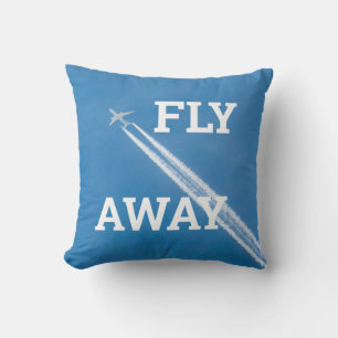 Coussin L'avion vole dans le ciel bleu