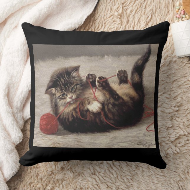 Coussin Le berceau de chat, un chat qui joue à la balle de (Couverture)