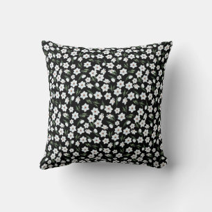 Coussin Lecteur de fleurs noires avec fleurs blanches