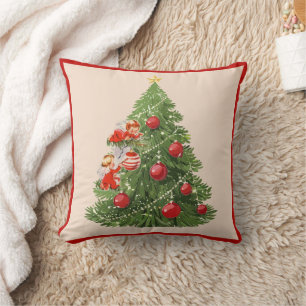 Coussin Les anges décorant l'arbre de Noël