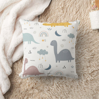 Coussin Les dinosaures et l'arc-en-ciel dans le ciel.