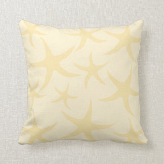 Coussin Les étoiles de mer modèlent en jaune en pastel
