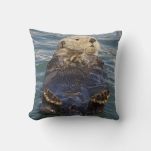 Coussin Les loutres de mer jouent sur les icebergs à Surpr