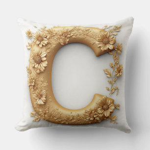 Coussin Lettre C dorée élégante avec des fleurs délicates