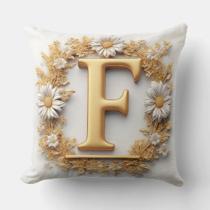 Coussin Lettre dorée F avec décoration de couronne florale