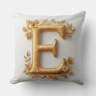 Coussin Lettre E dorée élégante avec des fleurs délicates