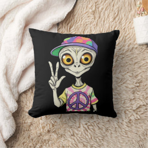 Coussin L'extraterrestre montre le signe de paix de la mai