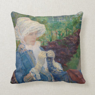 Coussin Lydia faisant du crochet dans le jardin à marneux