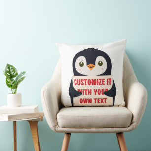 Coussin Mascotte manchot tenant un panneau pour un texte p