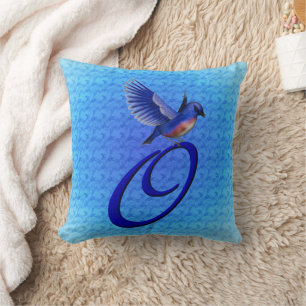 Coussin Monogramme d'oiseau bleu Initiale O
