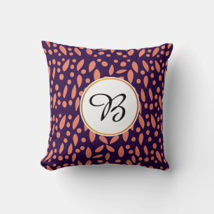 Coussin monogramme et feuille