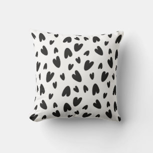 Coussin motif de coeurs noirs