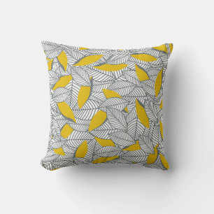 Coussin Motif de feuilles gris et jaune.