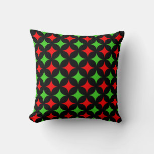 Coussin Motif d'étoile verte et rouge sur fond noir