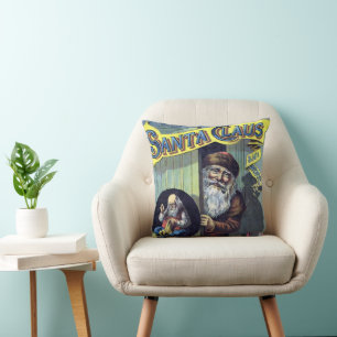 Coussin Noël vintage, le Père Noël et ses œuvres