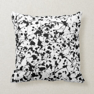 Coussin noir d'éclaboussure de peinture