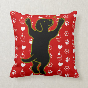 Coussin noir d'étreinte de chiot de Labrador